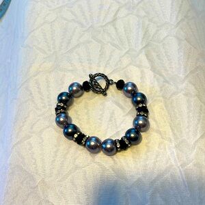 This beautiful black and pearlized grey bracelet is great for a gift